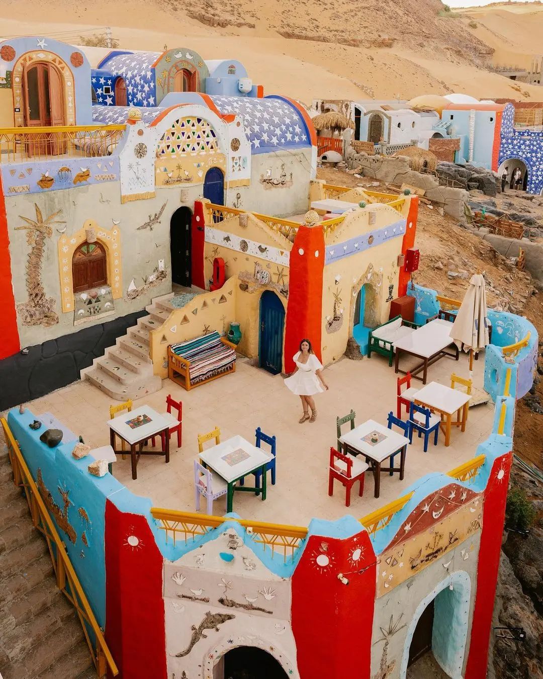 Colorful Nubian village with vibrant architecture overlooking the Nile in Aswan, Egypt